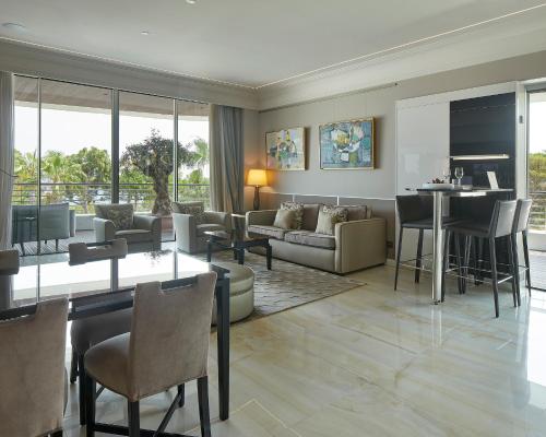a living room with a couch and a table at Alàbriga Hotel GL in S'Agaro