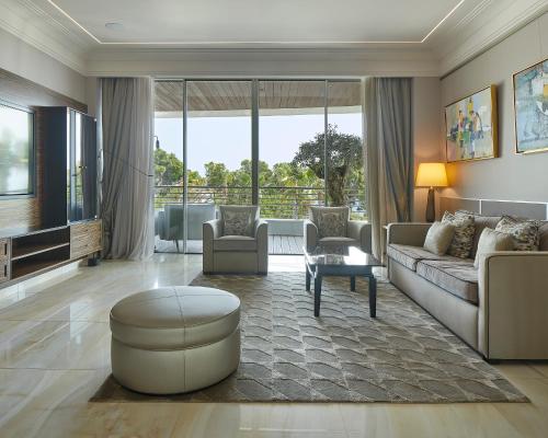 a living room with a couch and a table at Alàbriga Hotel GL in S'Agaro