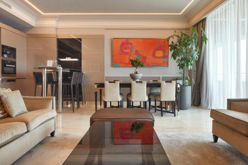 a living room with a couch and a table at Alàbriga Hotel GL in S'Agaro