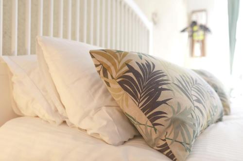 a pillow sitting on top of a bed at Studio - Les Traversières in Eymet