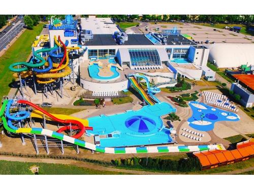 an aerial view of a water park with slides at StagHorn floating river house in Jūrmala