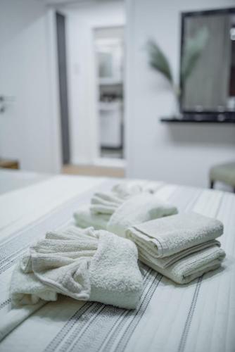 a group of towels sitting on top of a table at The SKVER-Elegant City Apartmant in Požarevac