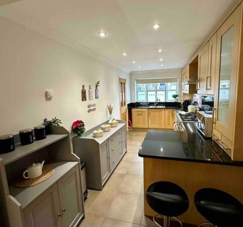 a large kitchen with a large island in the middle at Teta's House! in Oxford