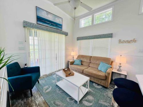 a living room with a couch and a table at Vacation Cottage North Myrtle Beach 65 in Myrtle Beach