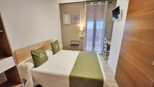Letto o letti in una camera di Eco Hotel Toledo