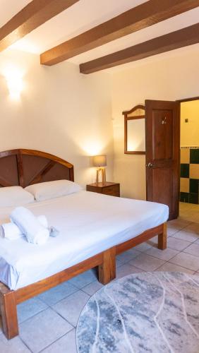 Ein Bett oder Betten in einem Zimmer der Unterkunft Esencia Puerto Escondido