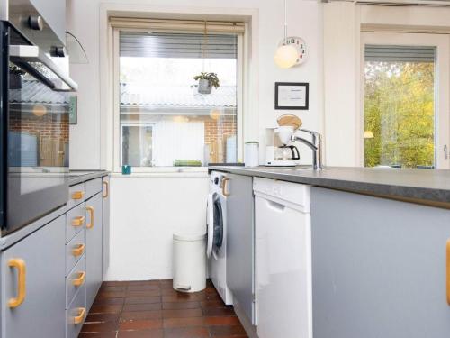 a kitchen with a sink and a dishwasher at 6 person holiday home in Hemmet in Hemmet