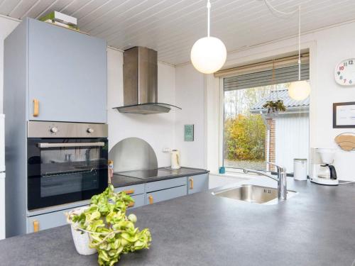 a kitchen with a sink and a stove top oven at 6 person holiday home in Hemmet in Hemmet