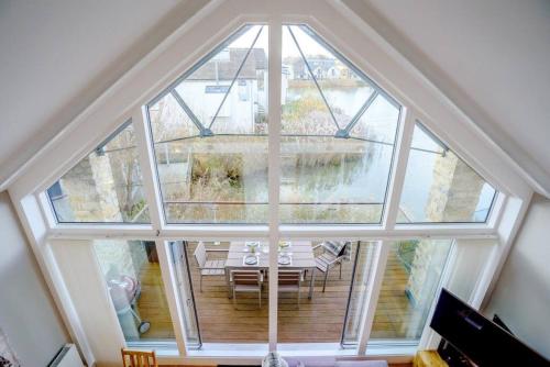 an overhead view of a room with a large window at Pennyroyal Lodge HM31 Lakeside Spa Property in Somerford Keynes