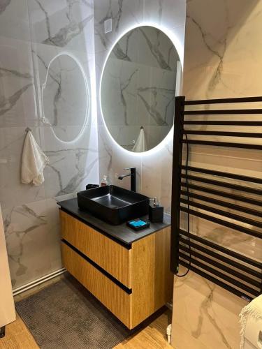 a bathroom with a sink and a mirror at Palaiomonastiro mountain resort 1 in Palaiomonástiron