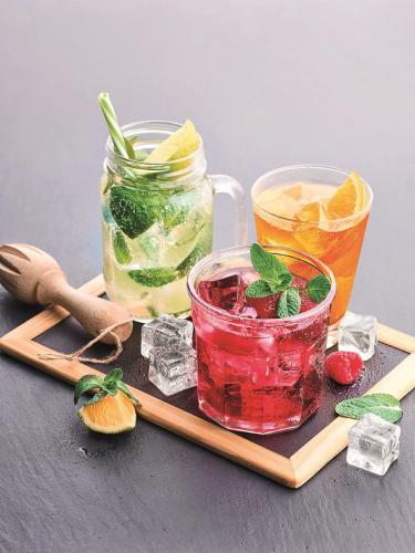 a wooden tray with two drinks on a table at Campanile Grenoble Sud - Seyssins in Seyssins