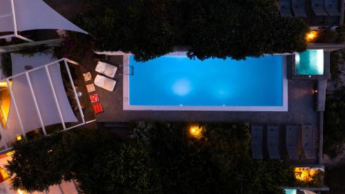 an overhead view of a swimming pool at night at 270 Oias View in Oia