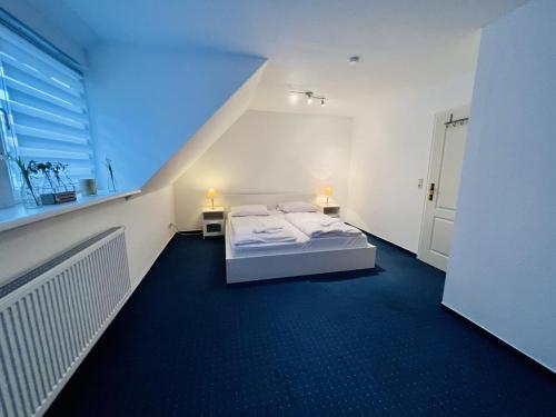 מיטה או מיטות בחדר ב-Ferienhaus Deich