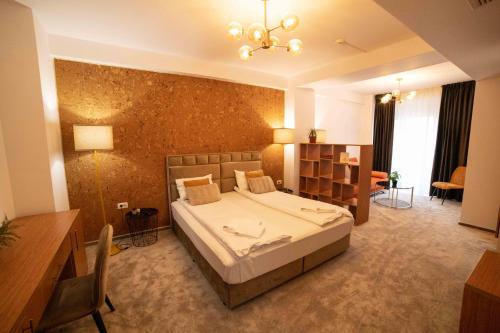 a bedroom with a large bed in a room at Bucharest Airport Accomodation in Otopeni