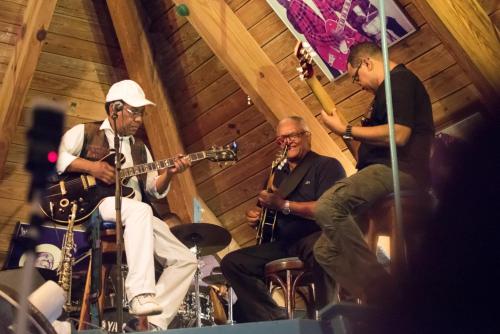 a group of men playing instruments in a room at Curacao Avila Beach Hotel in Willemstad