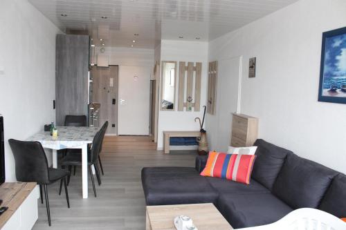a living room with a couch and a table at Ferienwohnung L432 für 2-4 Personen an der Ostsee in Brasilien