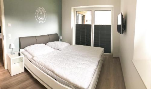 Un pat sau paturi într-o cameră la Zur Strandwiese W2