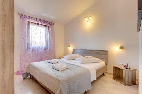 Postel nebo postele na pokoji v ubytování Apartment Alex