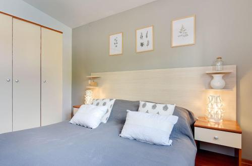 Ένα ή περισσότερα κρεβάτια σε δωμάτιο στο Zum Sandstrand sind es wenige Gehminuten - genießen Sie aber auch die Zeit am Pool