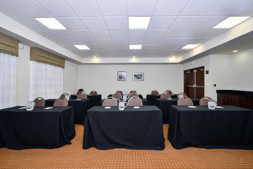 a conference room with tables and chairs in it at Sleep Inn & Suites Austin – Tech Center in Austin