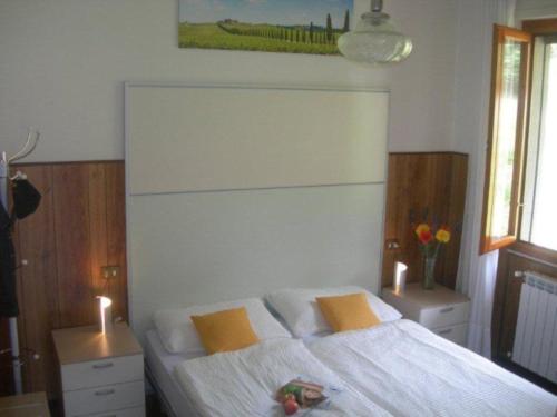 Ένα ή περισσότερα κρεβάτια σε δωμάτιο στο Tignale - Appartement VISTA BLU 107 - Ferienwohnung am Gardasee mieten