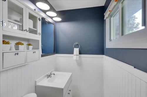 a bathroom with a white toilet and a sink at The Kentucky Bluegrass Retreat in Frankfort