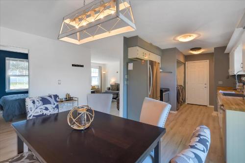 a kitchen and living room with a table and chairs at The Kentucky Bluegrass Retreat in Frankfort