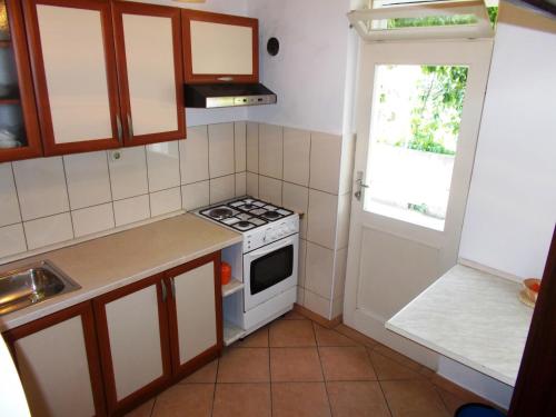 Kuchyň nebo kuchyňský kout v ubytování Apartments Markov Murter