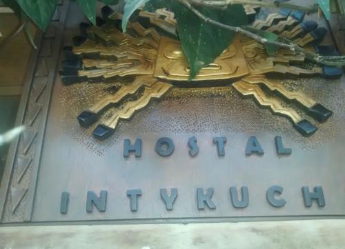 a sign for a hospital inuyuanauana on a building at Intykucha in Otavalo