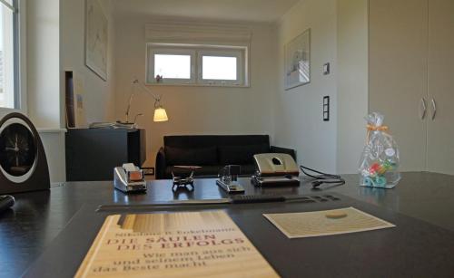 an office with a desk with a computer on it at Thor's Schleilounge in Olpenitz