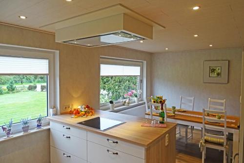 a kitchen with a large island with a counter top at Mee(h)r in Hasselberg