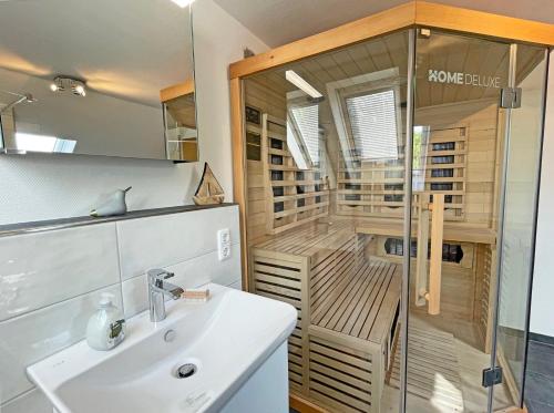a bathroom with a shower with a sink and a shower at Stadtoase in Süderbrarup