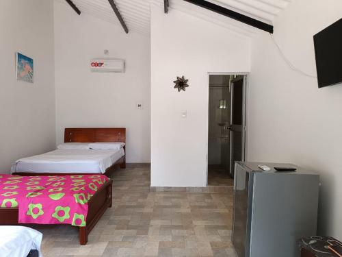 Postel nebo postele na pokoji v ubytování Cabaña Bugambilla - Villeta