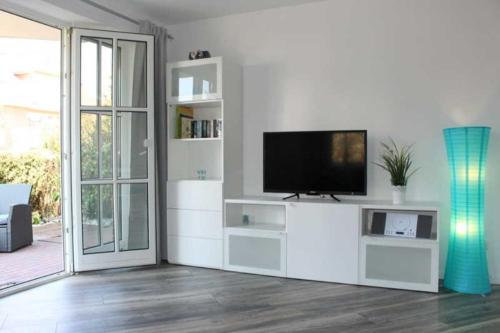 TV i/ili multimedijalni sistem u objektu Apartmentvermittlung Mehr als Meer - Objekt 12