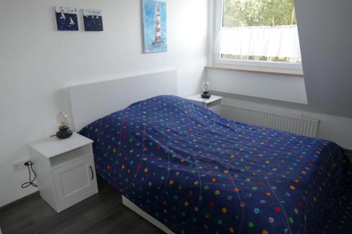 Кровать или кровати в номере kleines Strandhus