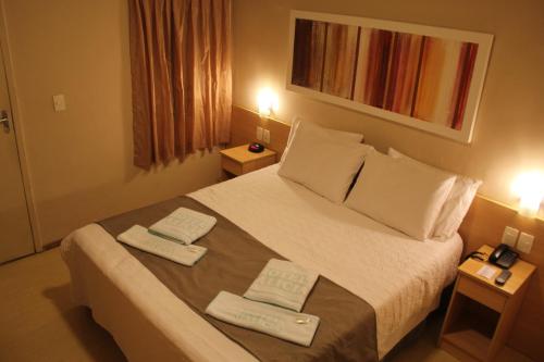 Ένα ή περισσότερα κρεβάτια σε δωμάτιο στο Hotel Galícia