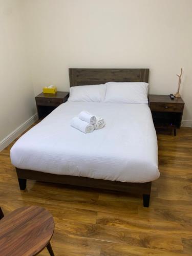 a bedroom with a bed with two towels on it at Silk Hotel in Boston