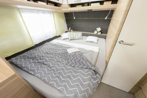 מיטה או מיטות בחדר ב-Campingplatz Wusterhausen
