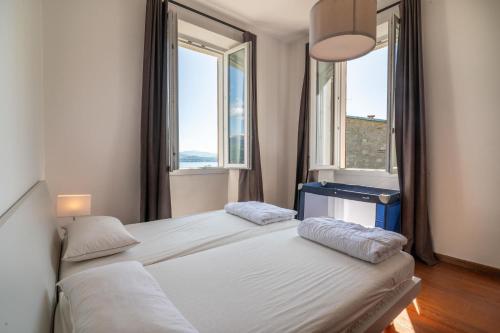 Postel nebo postele na pokoji v ubytování Villa Perondi