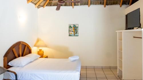 Ein Bett oder Betten in einem Zimmer der Unterkunft Esencia Puerto Escondido