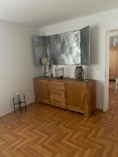 a room with a wooden dresser in a room at NEU! Ferienwohnung Milo Pfälzer Wald in Rodalben