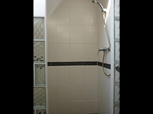 a shower stall in a bathroom with a shower head at NEU Ferienwohnung Storchennest OG in Kramerhof