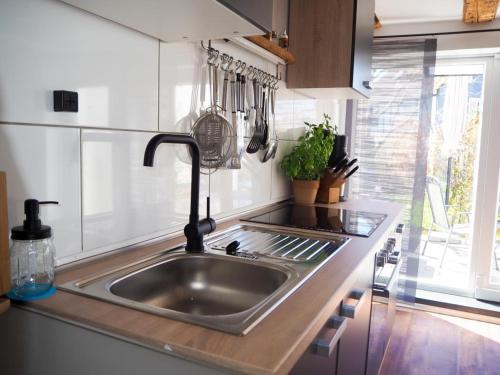 a kitchen counter with a sink in a kitchen at FeWo Westerwaelder Höhenluft in Langenbach bei Kirburg