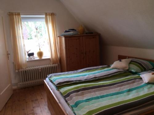 Postel nebo postele na pokoji v ubytování NEU! FeWo 1 Lüneburger Heide