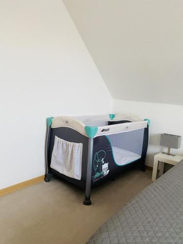 a bed in a room with a bed frame at Schicke Ferienwohnung Victorbur in Südbrookmerland