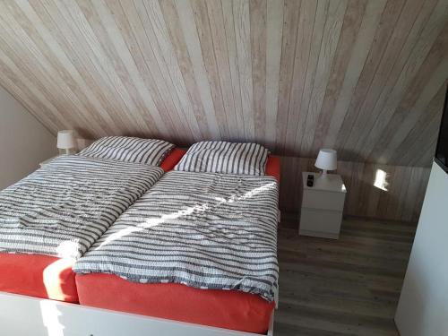 Ένα ή περισσότερα κρεβάτια σε δωμάτιο στο Ferienhaus Seeschwalbe 2