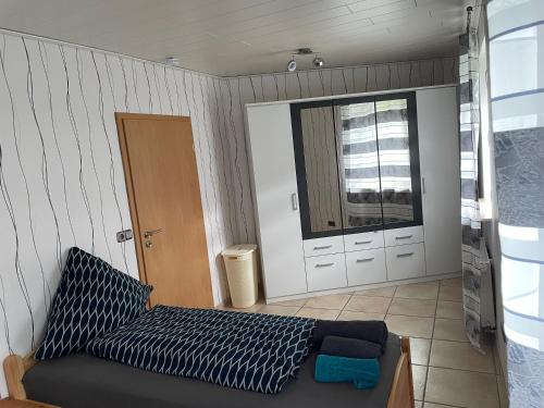 a room with a bed and a sliding glass door at NEU! Ferienwohnung am Bauna in Baunatal