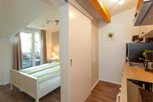 a bedroom with a bed and a window at NEU! Ferienwohnung Zur Eiche in Toppenstedt