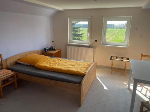 En eller flere senger på et rom på Ferienhaus Altenhof Müritz