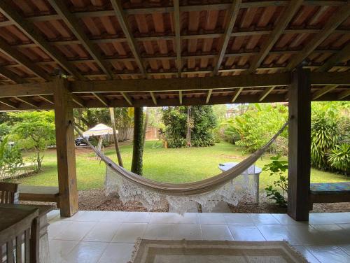 a hammock in a pavilion in a garden at Juréia Dreams in Juréia
